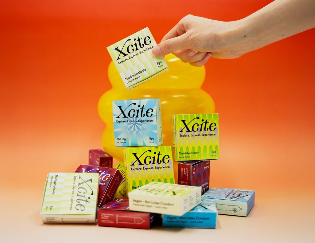 packages of Xcite on a orange background